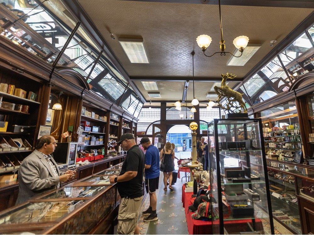 Dilip Sahijwani (left) works in Old Morris Tobacconist on Government Street in Victoria.