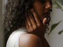 A model wears an oval lab diamond bezel ring from the Vancouver engagement ring studio Ma Folie. Handout/