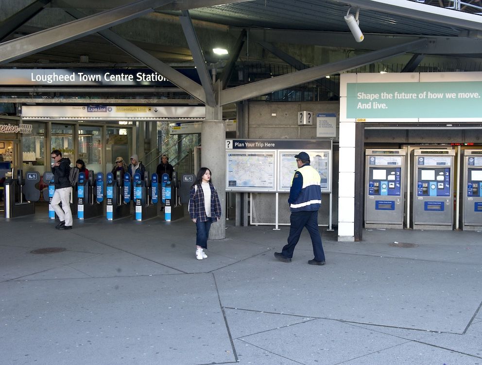 A SkyTrain supervisor walks past ticket machines at the Lougheed Town Centre SkyTrain Station. Two teenage boys have been charged after a string of robberies on the transit line.