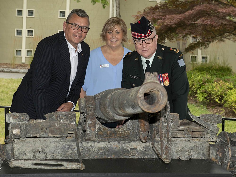 Left to right: City Of Vancouver Coun. Mike Klassen, PNE CEO Shelley Frost and Lieutenant-Colonel Steve McNally with one of the cannons repatriated at a ceremony on Tuesday at the PNE Fairgrounds.