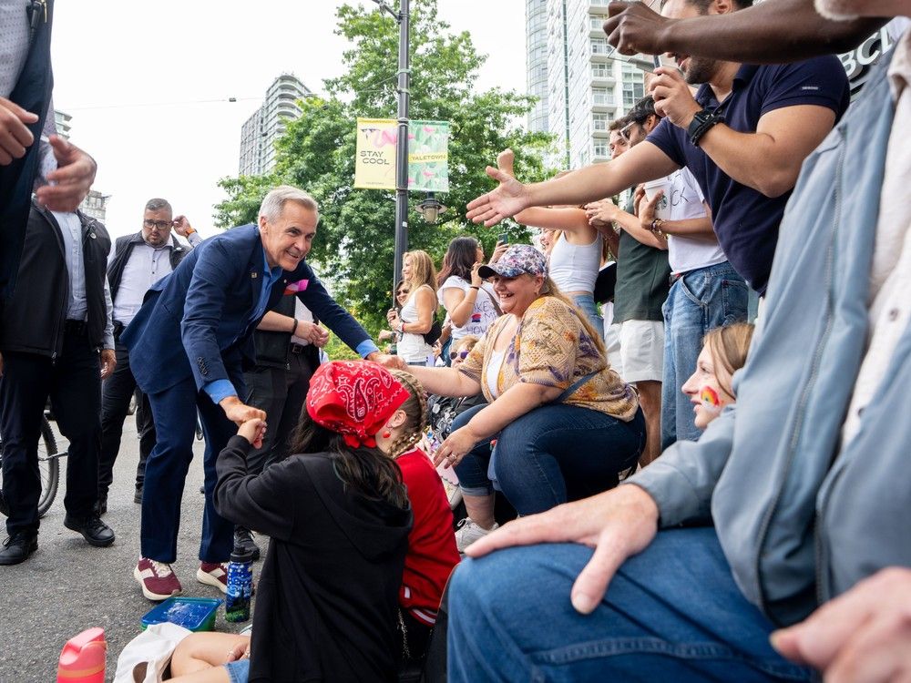  prime minister mark carney marches in the vancouver pride parade in vancouver, on sunday, august 3, 2025.