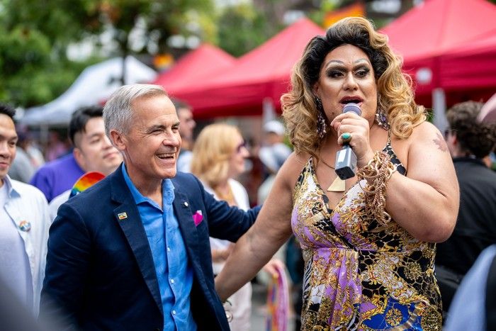 Prime Minister Mark Carney speaks with a drag performer during the Vancouver Pride Parade in Vancouver, on Sunday, Aug. 3, 2025. Prime Minister Mark Carney speaks with a drag performer during the Vancouver Pride Parade in Vancouver, on Sunday, Aug. 3, 2025.