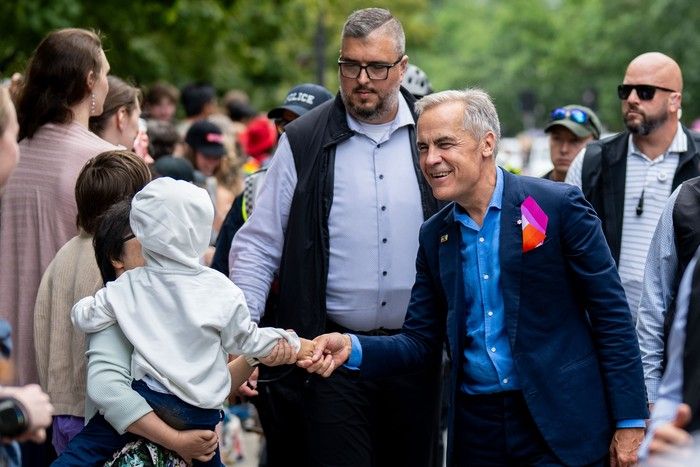 Prime Minister Mark Carney greets people during the Vancouver Pride Parade in Vancouver, on Sunday, Aug. 3, 2025. Prime Minister Mark Carney greets people during the Vancouver Pride Parade in Vancouver, on Sunday, Aug. 3, 2025.