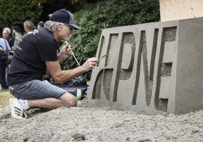  Sand sculptor Bruce Waugh from Sandemonz sand sculpture company puts the finishing touches on a sand sculpture at the PNE Aug. 14.
