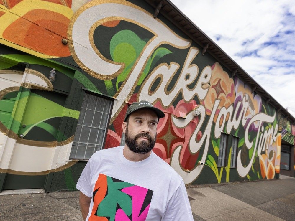  Drew Young with art outside on the Astro Club Artist Facility in Vancouver.