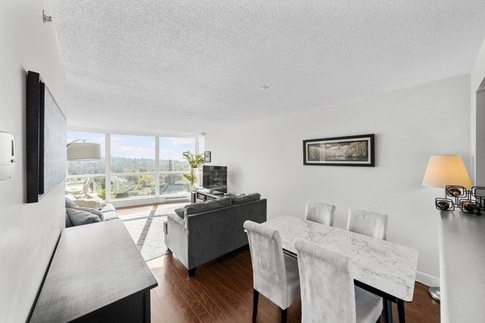  Residence features full-height windows in the living room.