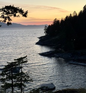 View of the sun setting from the forest boardwalks at Rockwater Secret Cove Resort. Credit: Mary Beth Roberts. For Westcoast Homes & Design magazine Sunshine Coast travel story for Fall 2025 issue.