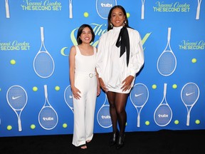 Kay Jayme and Naomi Osaka stand next to each other.