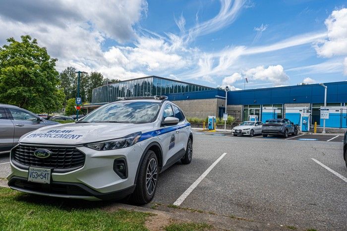 A bylaw enforcement vehicle is parked at the Port Moody Recreation Complex with EV charging stations in the background. Bob Homer photography A bylaw enforcement vehicle is parked at the Port Moody Recreation Complex with EV charging stations in the background. Bob Homer photography