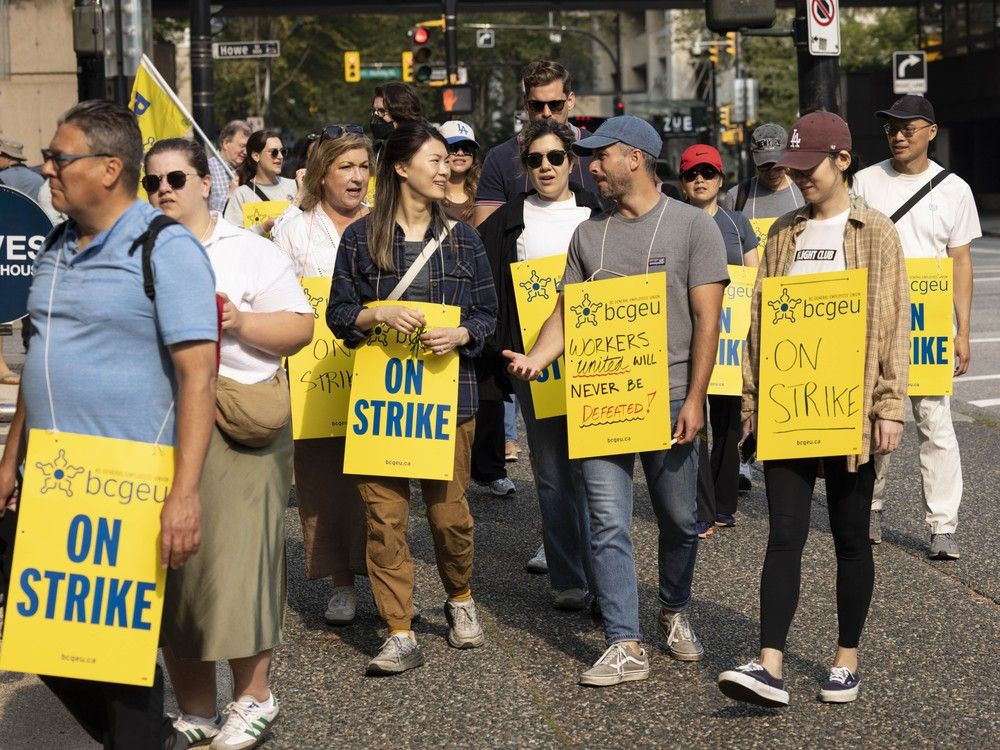  Members of the BCGEU picket line outside a Ministry of Finance office at 900 Howe Street in Vancouver on September 4, 2025