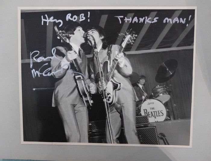 Rob Frith hands over 1962 Beatles demo tape to Paul McCartney