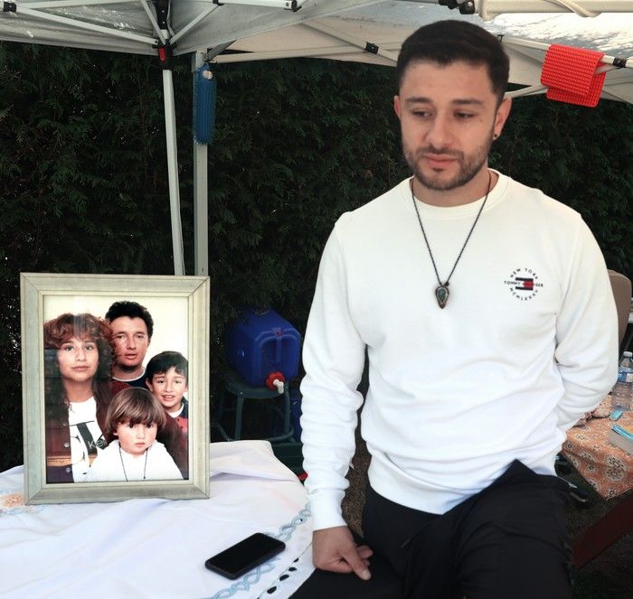  alejandro samper with a photo of his mother, glitza, his father, daniel, and sister, nena, who were killed in the lapu lapu day tragedy.