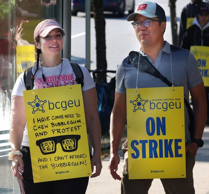  bcgeu workers on a picket line at the b.c. liquor distribution branch office at 3383 gilmore way