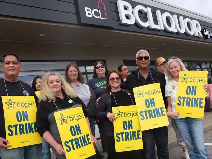 BCGEU liquor store workers on a picket line at a BC Liquor outlet on 24th Street in White Rock. BCGEU liquor store workers on a picket line at a BC Liquor outlet on 24th Street in White Rock.