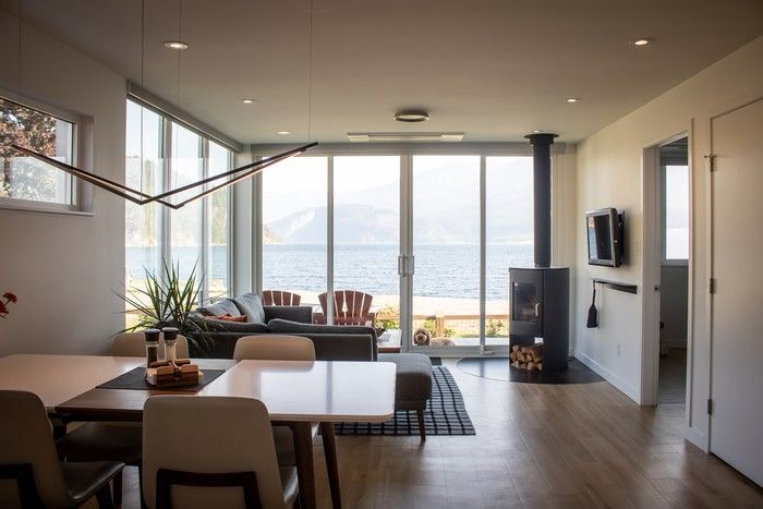 A slimmed-down living room offers a cozy space for socializing, with a cylindrical wood fireplace, Nectre’s N65 model, for extra warmth and ambience.  A slimmed-down living room offers a cozy space for socializing, with a cylindrical wood fireplace, Nectre’s N65 model, for extra warmth and ambience.