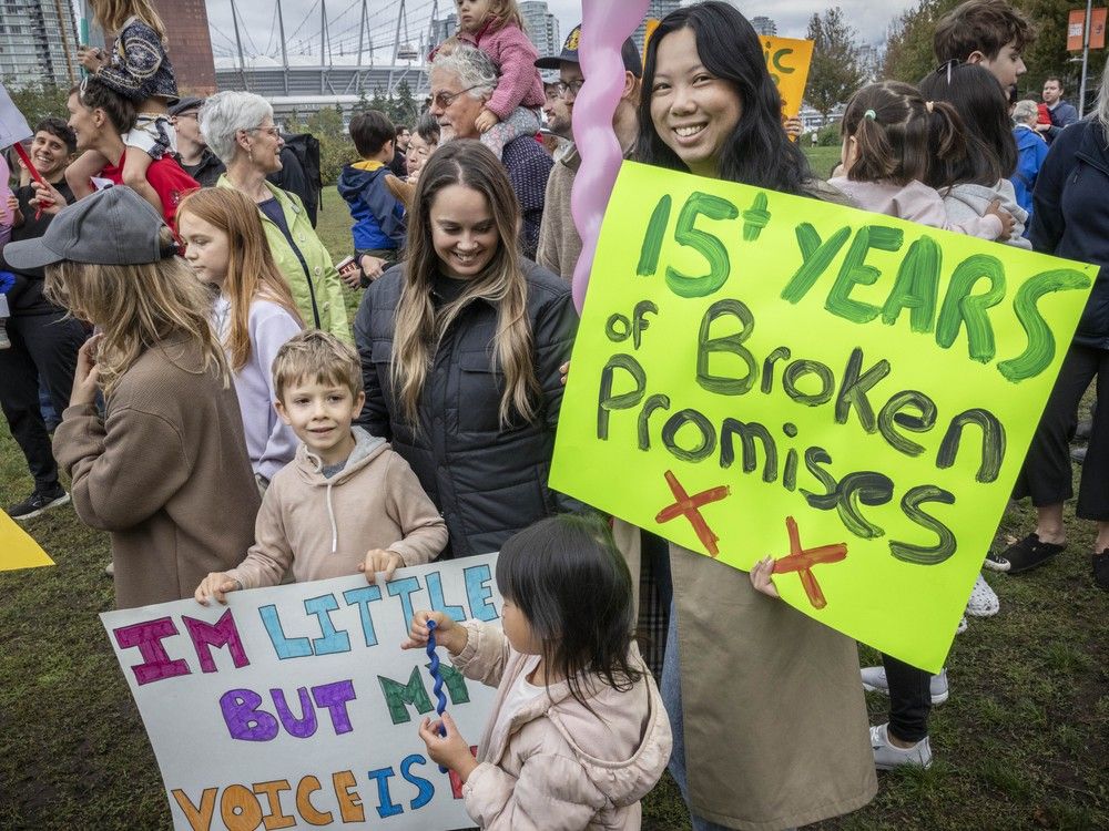 Families from the Olympic Village rally at Hinge Park in Vancouver, demanding action on a long-promised school for the neighbourhood. Families from the Olympic Village rally at Hinge Park in Vancouver, demanding action on a long-promised school for the neighbourhood.