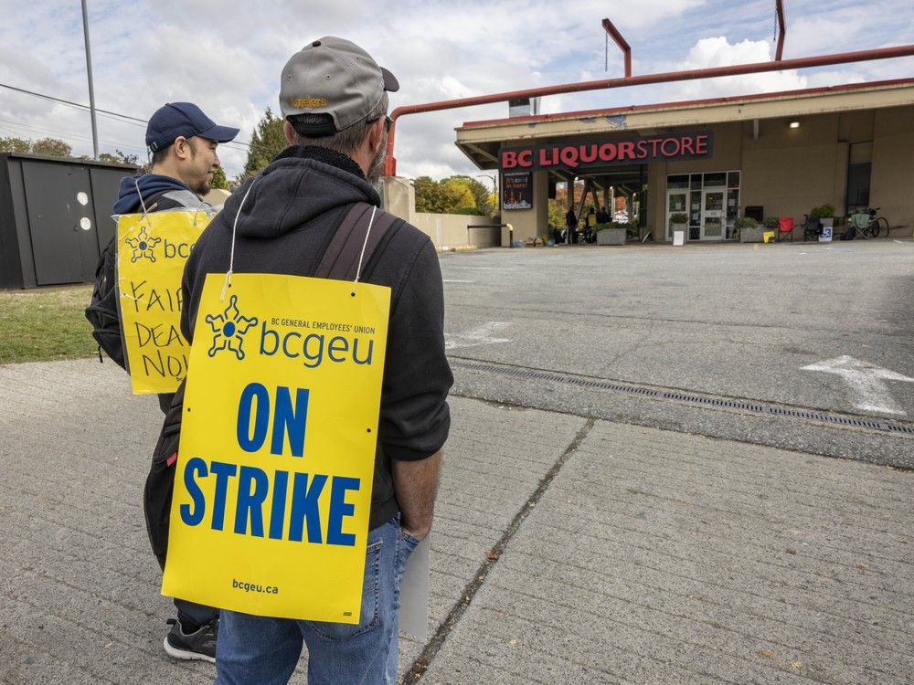 BCGEU members walk the picket line outside the B.C. Liquor store at Broadway and Lillooet Streets in Vancouver on Oct. 8, 2025. BCGEU members walk the picket line outside the B.C. Liquor store at Broadway and Lillooet Streets in Vancouver on Oct. 8, 2025.