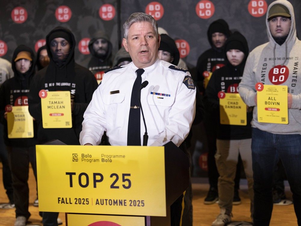 B.C. RCMP Commanding Officer Deputy Commissioner Dwayne McDonald speaks at a event where the BOLO program unveiled its 25 most wanted fugitives in Canada in Vancouver on Wednesday, October 8, 2025. Each of the 25 fugitives was represented by a police officer who approximately fit the physical description of the suspects, and wearing a mask with the suspect's likeness. B.C. RCMP Commanding Officer Deputy Commissioner Dwayne McDonald speaks at a event where the BOLO program unveiled its 25 most wanted fugitives in Canada in Vancouver on Wednesday, October 8, 2025. Each of the 25 fugitives was represented by a police officer who approximately fit the physical description of the suspects, and wearing a mask with the suspect's likeness.