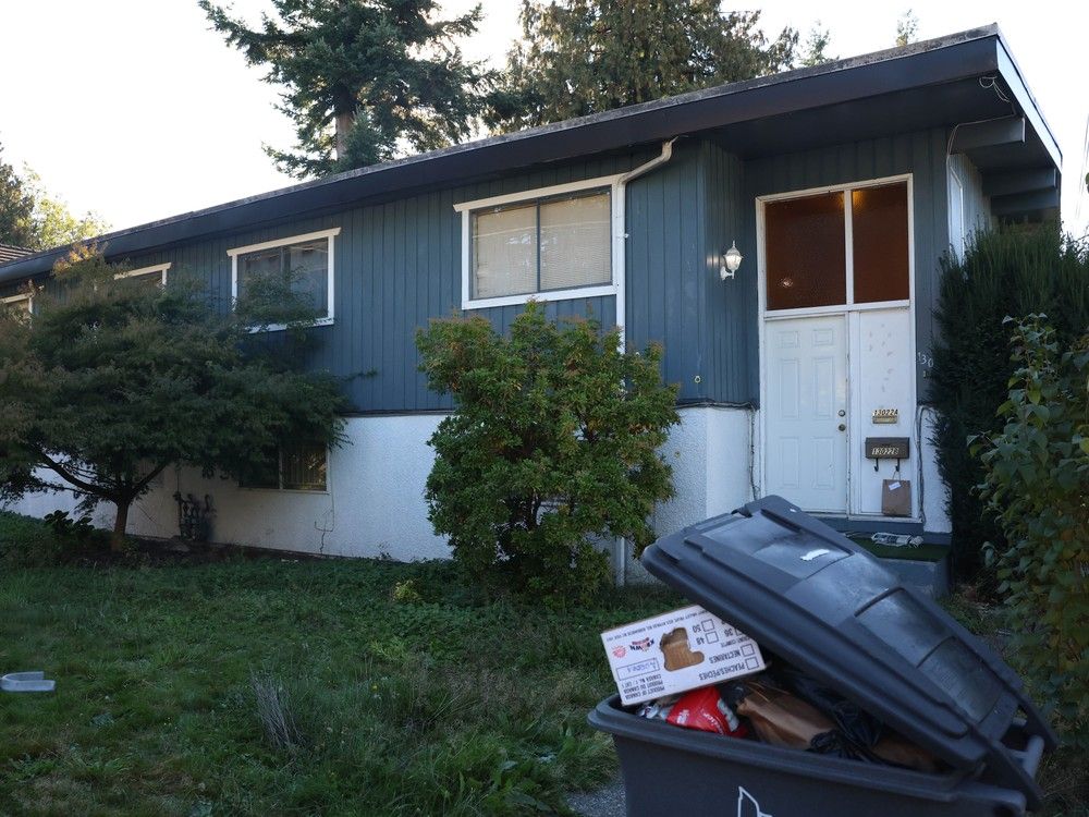 The home where an extortion-related shooting injured a woman in Surrey on the weekend. The home where an extortion-related shooting injured a woman in Surrey on the weekend.