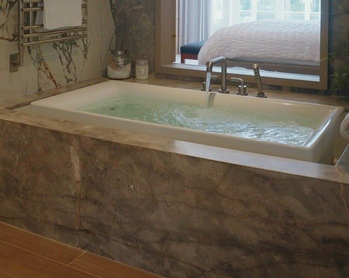  An infinity tub creates an instant home spa feel.