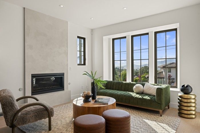  A formal living space at the front is perfect for entertaining visitors in front of a glowing fireplace, appointed with a hand-applied plaster surround.