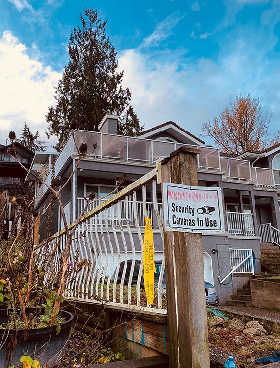  A sign posted outside a Surrey home where shots were fired on Sunday, Nov. 23, 2025.