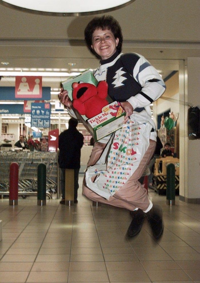  File photo from Dec. 23, 1996: Customer Rhonda Friisdahl jumps for joy after picking one of 360 Elmo dolls that went on sale at the Toys “R” Us store at Metrotown Mall.