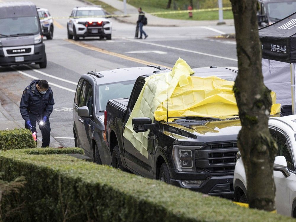 Surrey, BC: NOVEMBER 29, 2025 -- Police investigate a shooting that left one man dead Friday night in the 10400-block of 152nd Street in Surrey, BC.