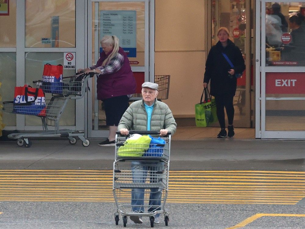  Shoppers leave a grocery store in Mission. Research shows people are switching brands, reducing variety, cooking more at home, or delaying purchases altogether due to the high cost of food.