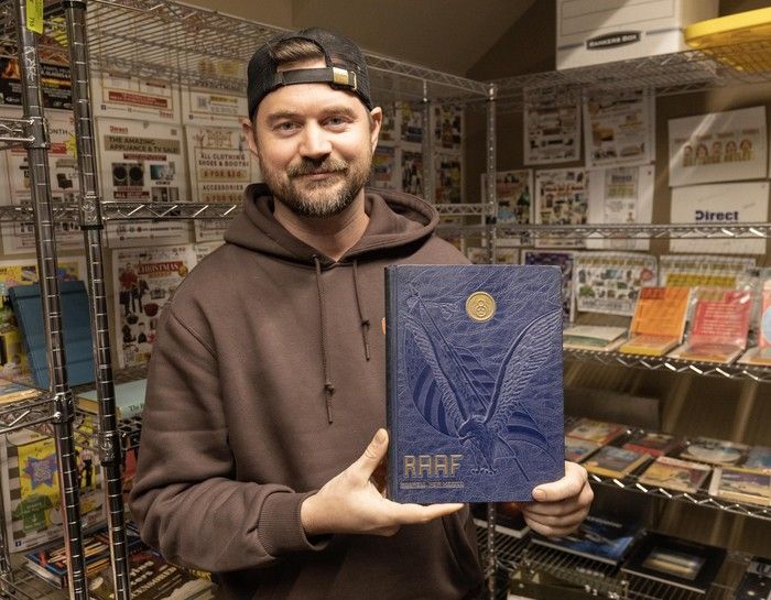 Mike McCune with a 1947 Roswell Air Force base yearbook. The yearbook is from the year an alien spaceship UFO enthusiasts believe crashed near Roswell. It is among the UFO memorabilia that will be auctioned by Direct Liquidation in Vancouver.