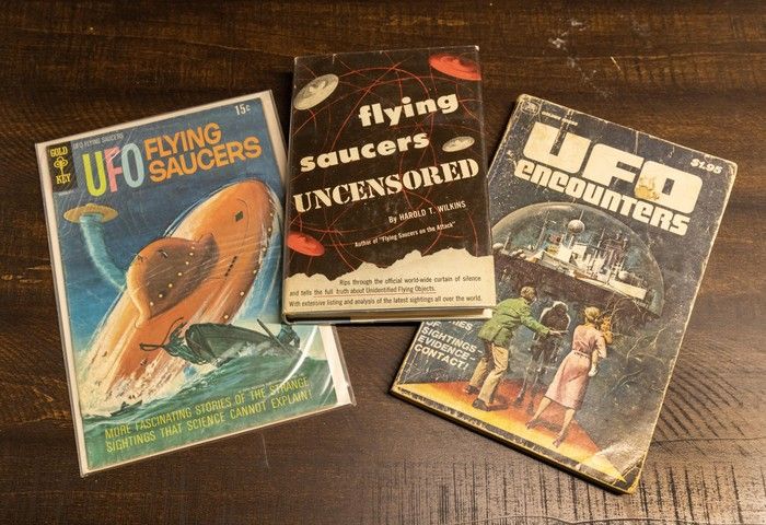  The collection includes many vintage UFO books and magazines.