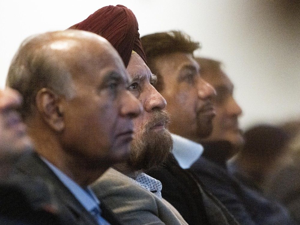  Community members listen to speakers at a forum where Vancouver Police officers discussed the extortions impacting communities in Metro Vancouver