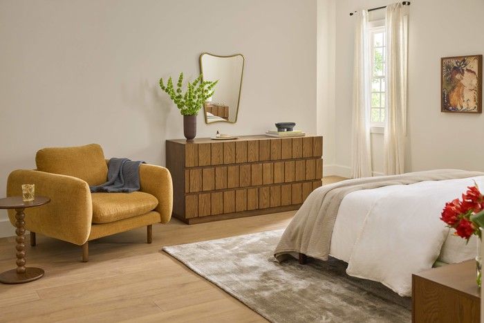  Sanders Ginger lounge chair, Hallie smoked oak side table and Marko smoked oak dresser by Article.