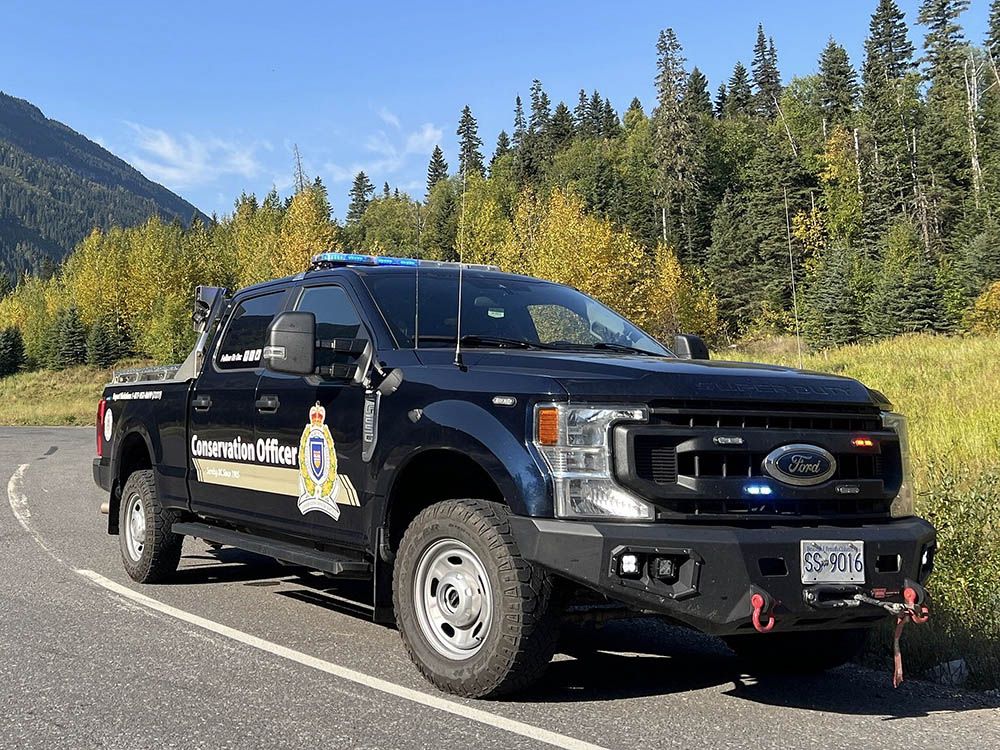 File photo of a B.C. Conservation Officer Service truck at a hunting checkstop.