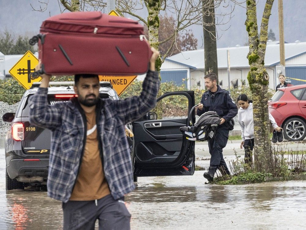 'This is insanity': The 2021 flood was on the minds of many, with weariness and anger on the faces of those who gathered to watch the water.