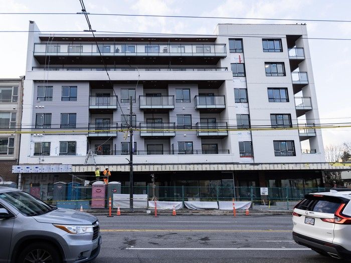A nearly completed six-storey building under construction on Commercial Drive in Vancouver.