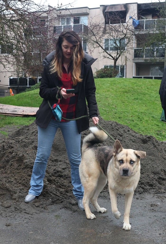  kaja kretz on her phone following an apartment building fire at 11675 seventh ave