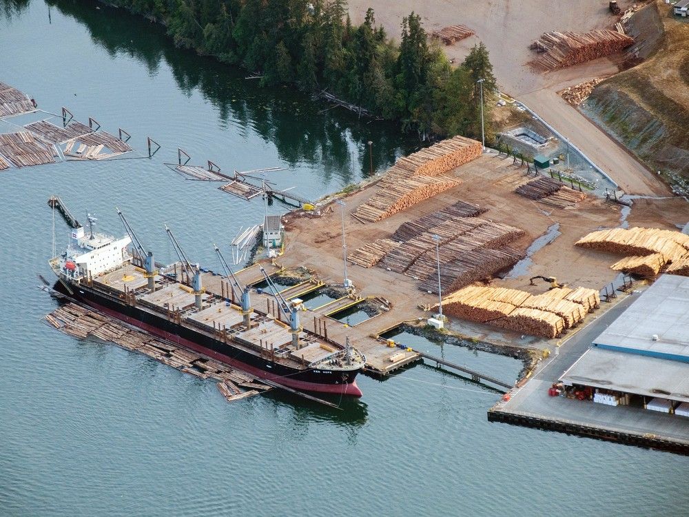 Raw lumber sits stacked at the Catalyst Paper Corp. Crofton Mill in this aerial photograph taken above Victoria on Aug. 12, 2018.