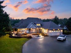 This 8,072-square- foot residence at 23455 8th Avenue, in Langley, offers six bedrooms, six bathrooms and part ownership of Murchie Lake.