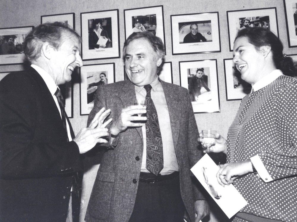 Paddy Sherman, head of Southam's newspaper division (left), Gazette reporter Claude Arpin and Gazette Editorial Page Editor Joan Fraser celebrate Arpin and Fraser's winner of Southam's President's Awards, in the Montreal Gazette's offices on Sept. 3, 1987.