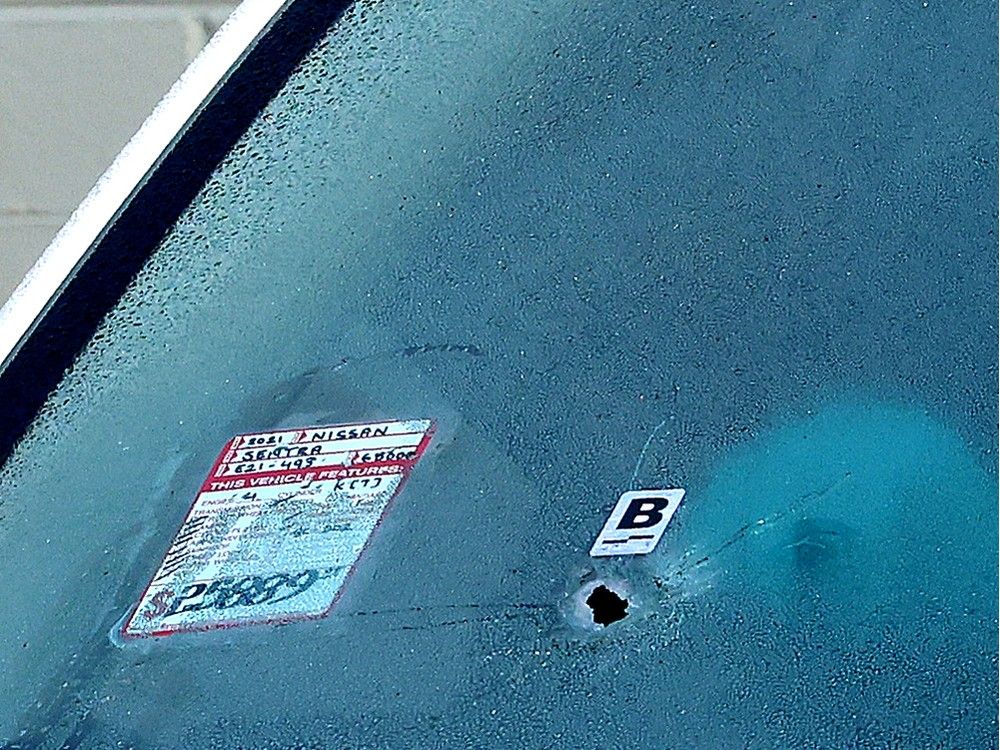 The scene at Skyline Auto Group following an early morning shooting suspected to be extortion related, in Surrey on Tuesday.