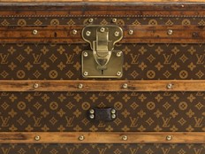 A Louis Vuitton Low Trunk in Monogram Canvas from 1906.