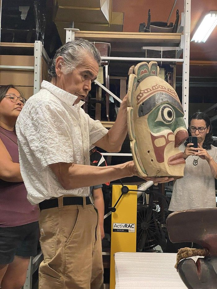  Don Willie at the Museum of Vancouver examining the King of the Underworld mask in August 2024.