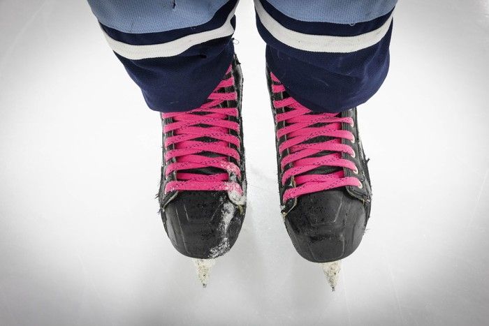 Cutting Edges team member Reid Hearsum laces up at Burnaby’s Scotia Barn hockey facility.
