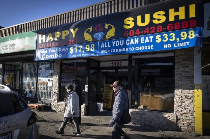Happy Sushi (5137 Victoria Drive) packs a lot of info into its sign.