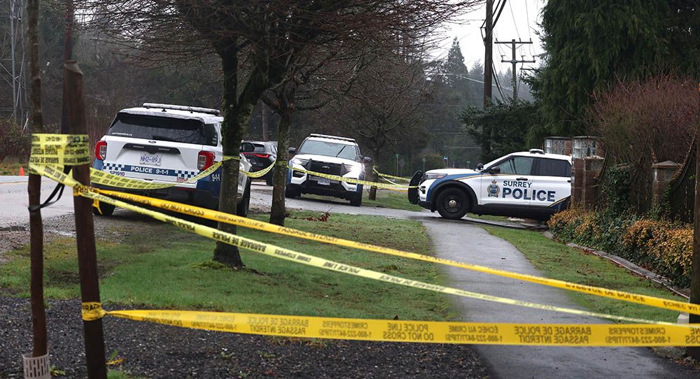 Surrey police gather evidence after a fire at 12732 56th Ave. in Surrey. A man was found dead inside and IHIT has taken over the case.