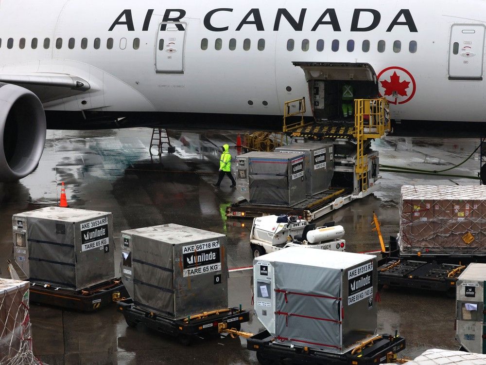 An Air Canada plane is loaded with cargo at Vancouver International Airport on Feb. 2 as the airport saw record numbers for both passenger travel and cargo shipments in 2025.