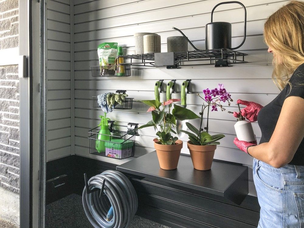 A practical potting station turns the garage into a helpful gardener's organization space.