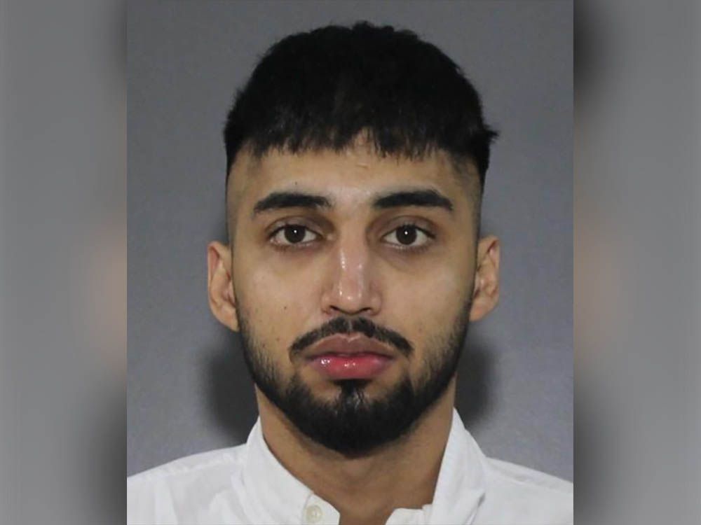 Surrey police have released a photo of 22-year-old Lovebir Singh, a foreign national who was removed from Canada after being identified as a suspect in an extortion incident.