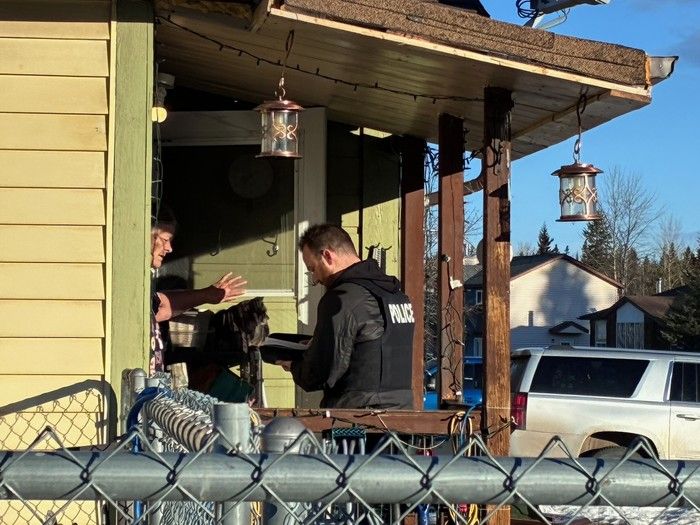  Police speak with residents in Tumbler Ridge following Tuesday’s shooting rampage at a school that left nine victims. The shooter also was found dead. Rob Brown/Postmedia